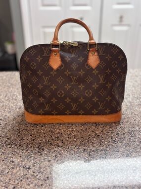 Louis Vuitton Brown Monogram Alma Handbag with Vachetta Trim